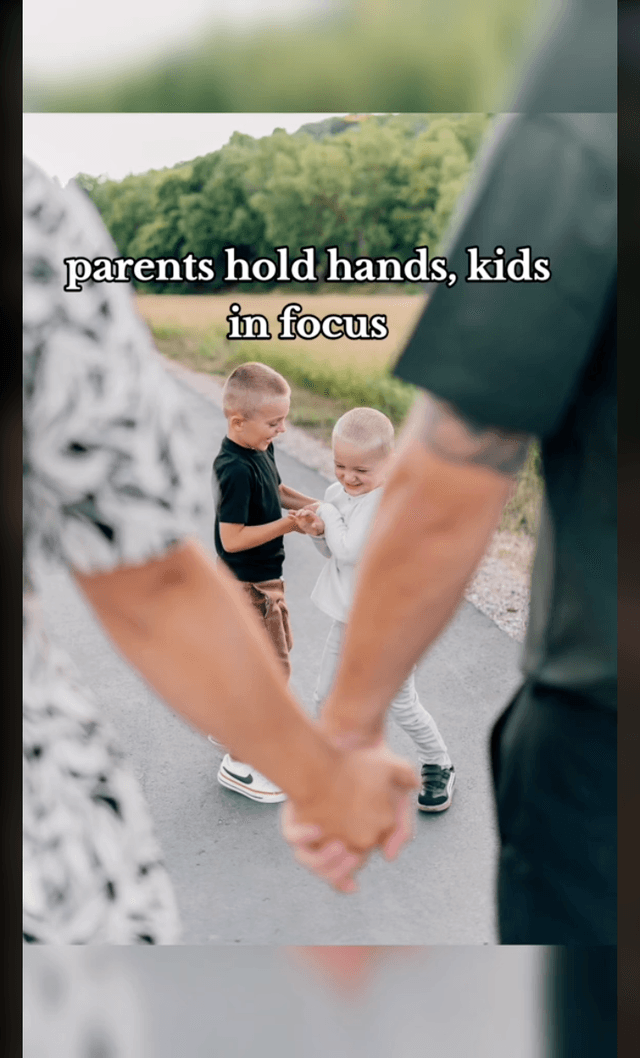 parents hold hands, kids in focus
