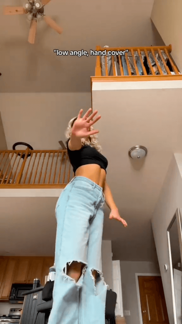 "low angle, hand cover"